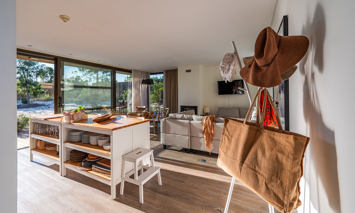 The Beach Villas with Children's Pool of Pestana Tróia Eco Resort have a room with kitchen, sofa and several cabinets