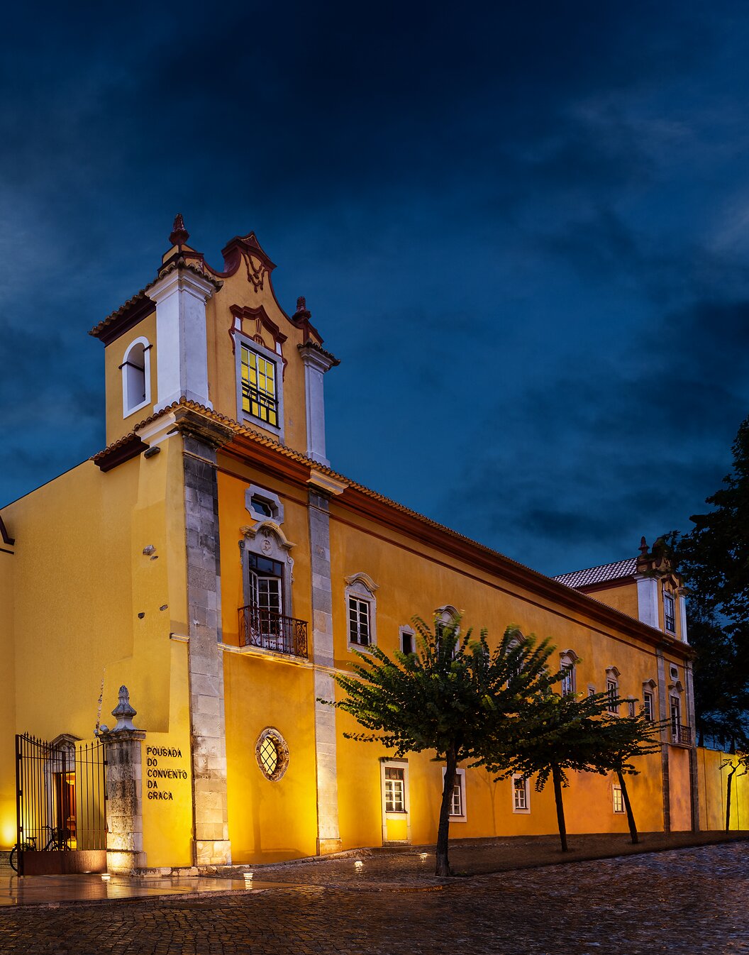 Illuminated building of Pestana Tavira, a historic hotel in Tavira, former Convent of Nossa Senhora da Graça