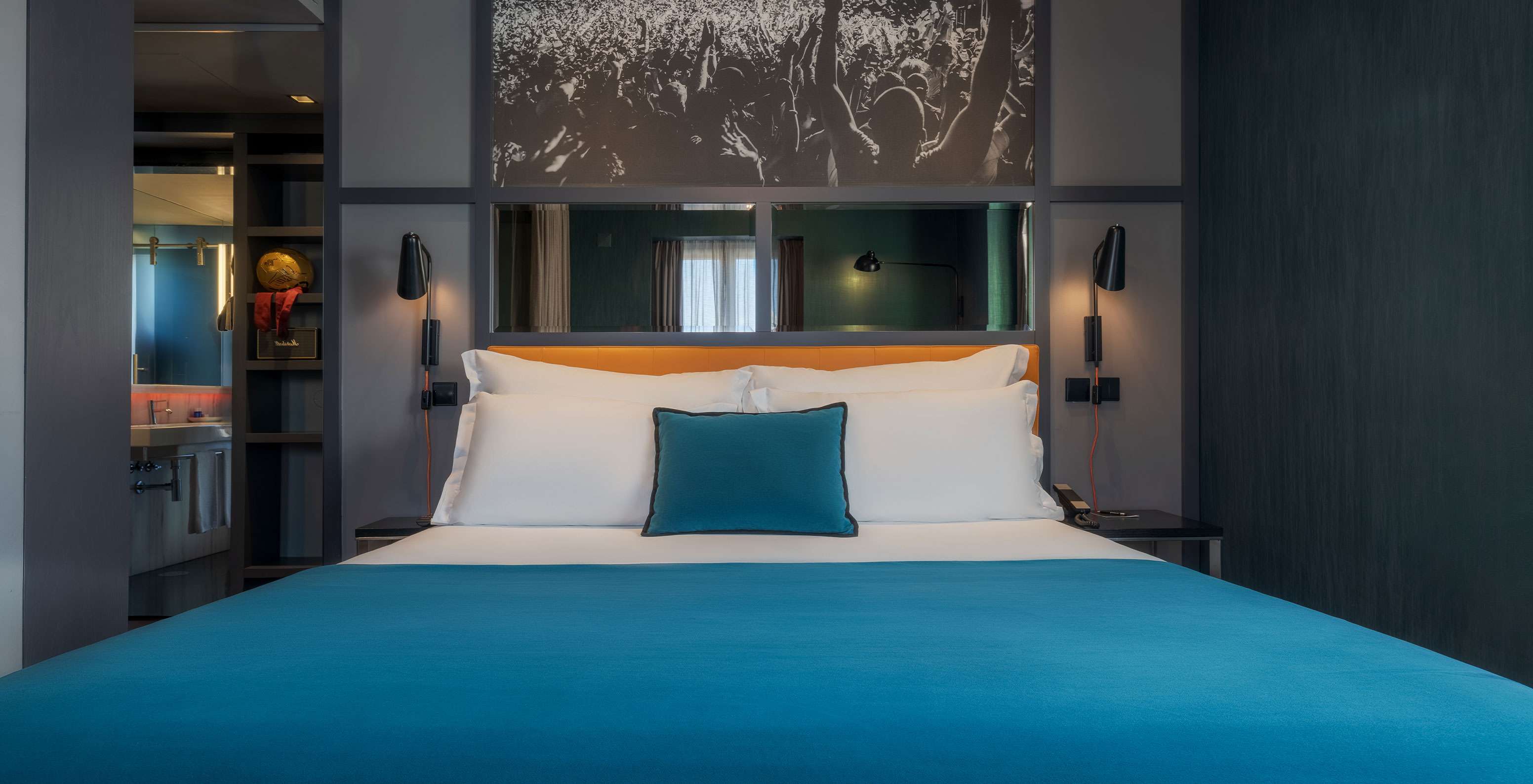 The CR7 Superior Corner Room at Pestana CR7 Lisboa has a double bed and a mirror above it