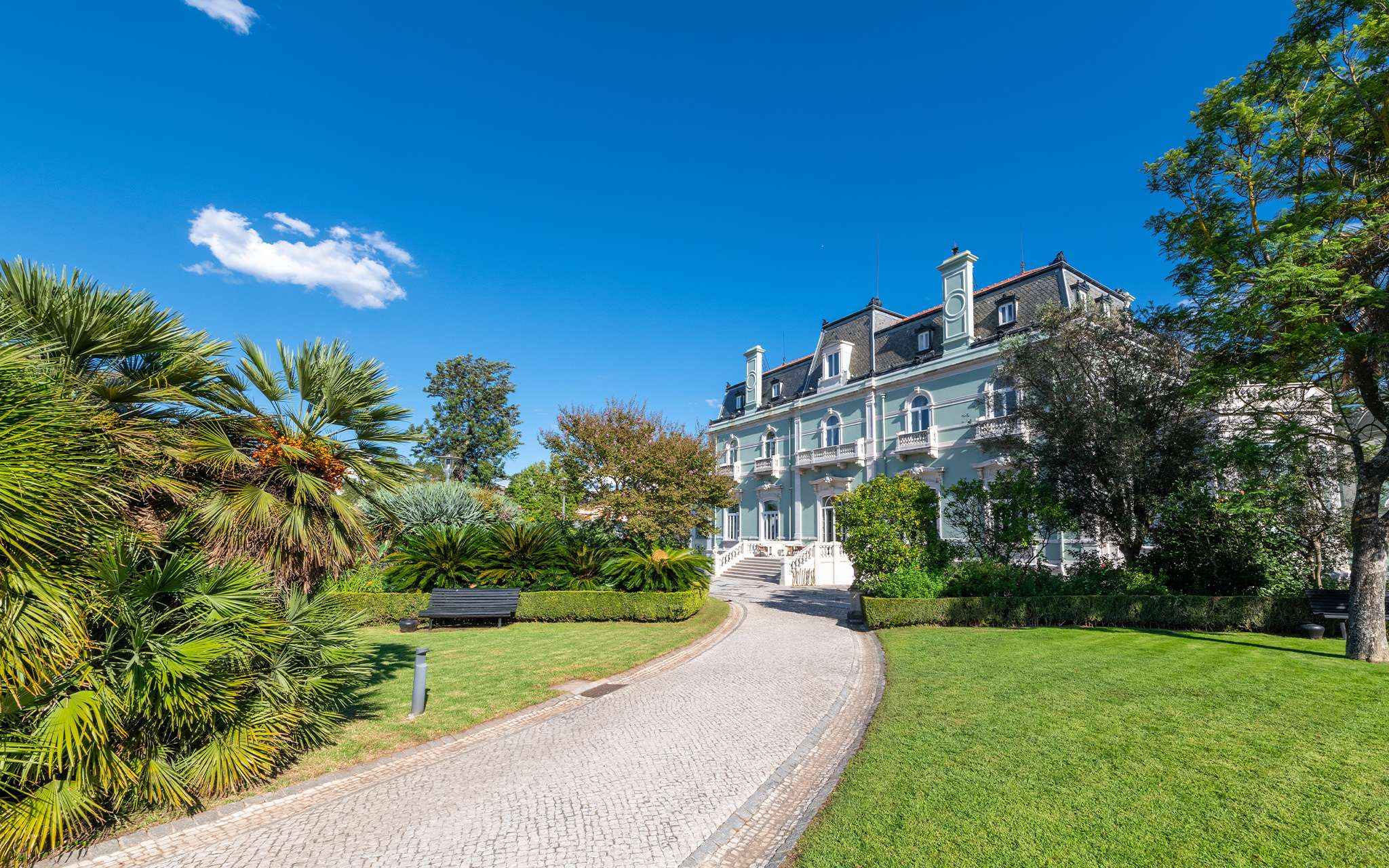 View of the Pestana Palace Lisboa building, a 5-star hotel, National Monument, an old palace surrounded by well-kept gardens