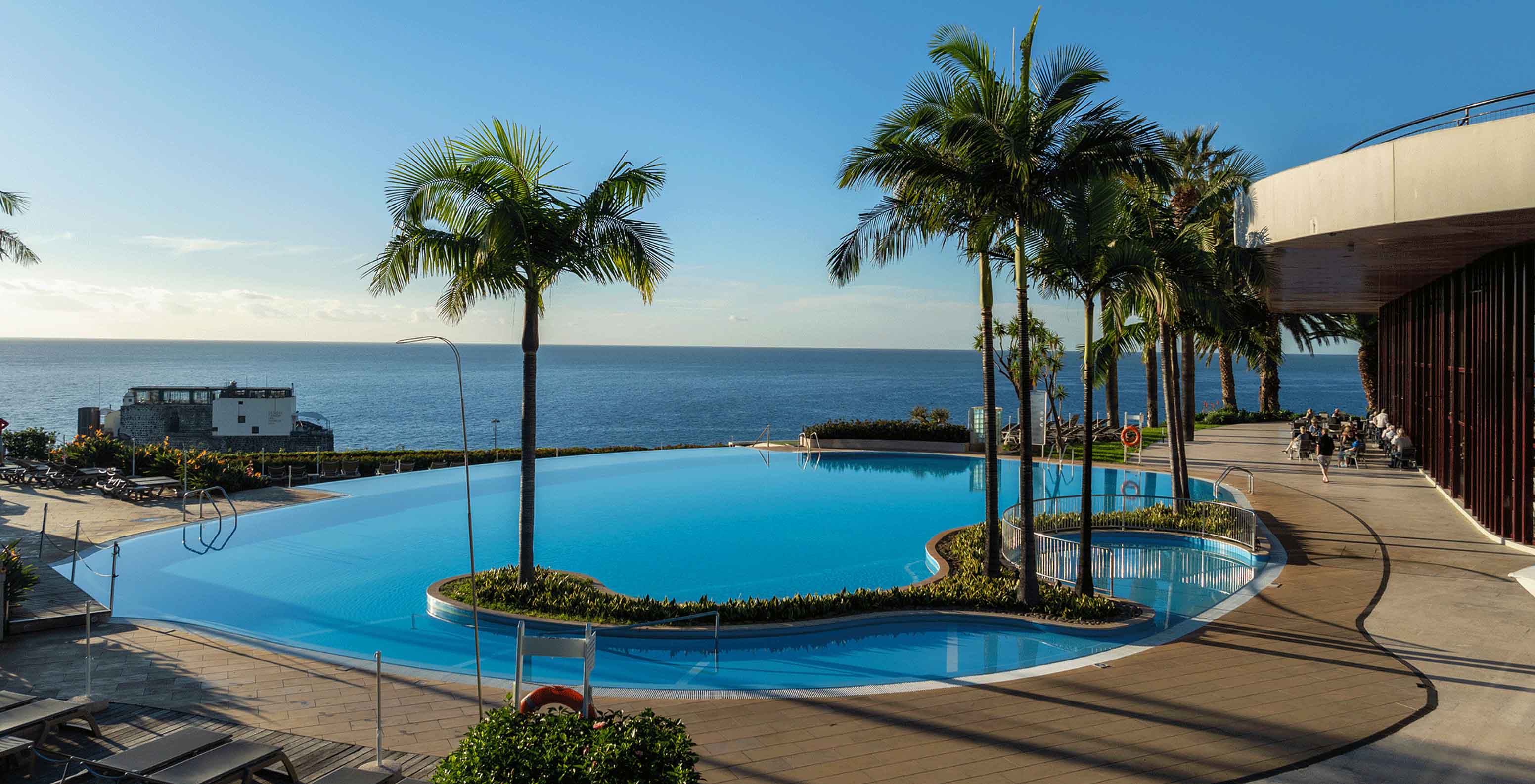 Outdoor pool with sea view at Pestana Casino Park, hotel in Funchal by the sea, with spa and pool