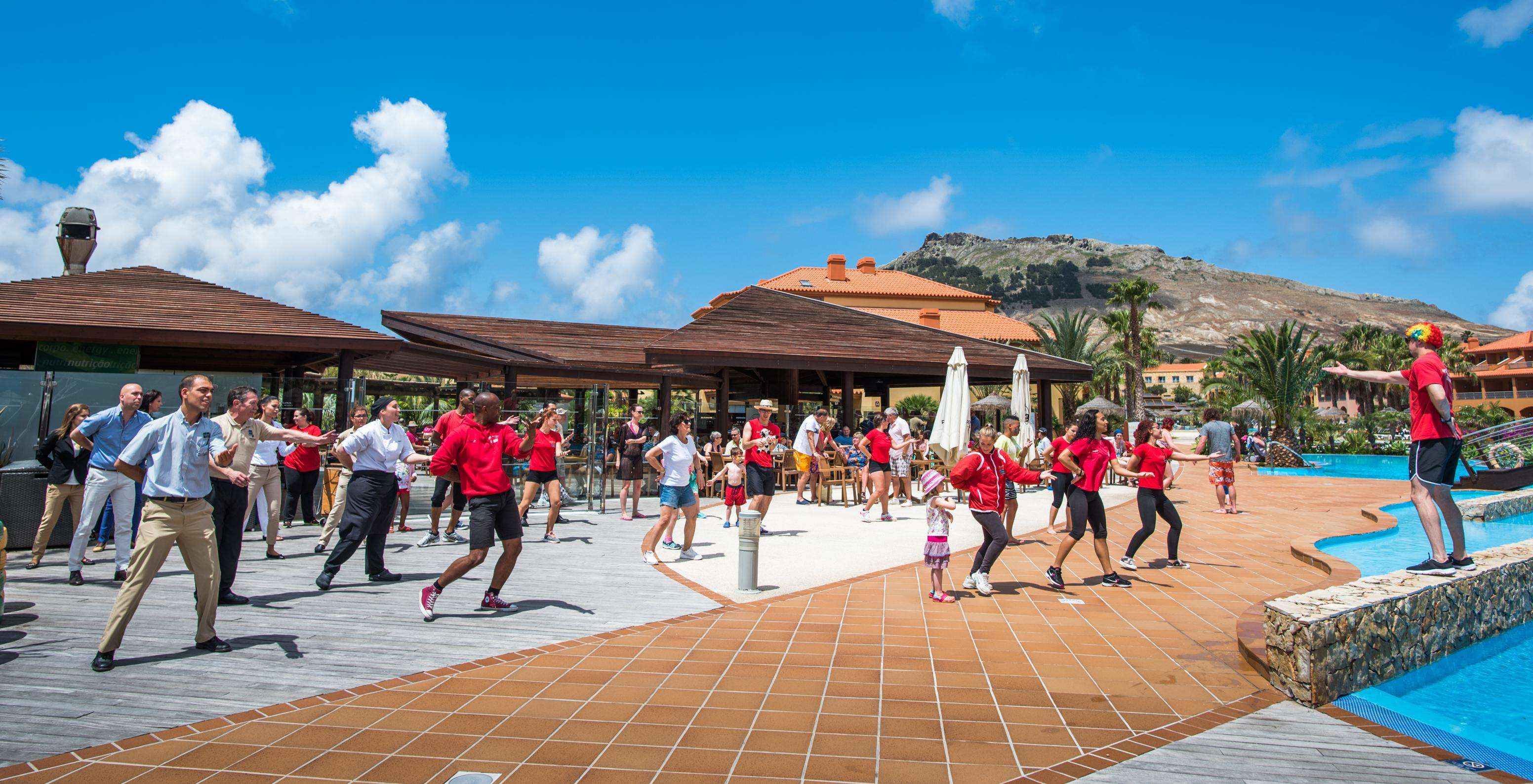 Zumba classes on a sunny day, by the outdoor pool of Pestana Porto Santo, hotel with all-inclusive and spa in Porto Santo