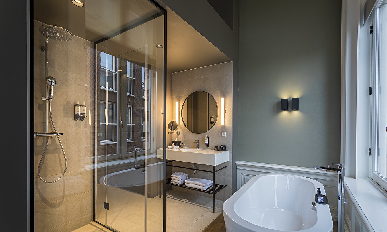 Presidential Master Suite - River View at Pestana Amsterdam Riverside has a bathroom with mirror, sink, and shower