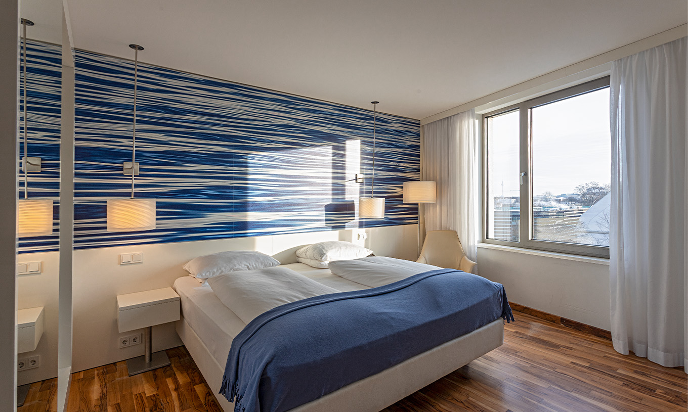 Deluxe High Floor room at Pestana Berlin Tiergarten has a double bed and a window with city view