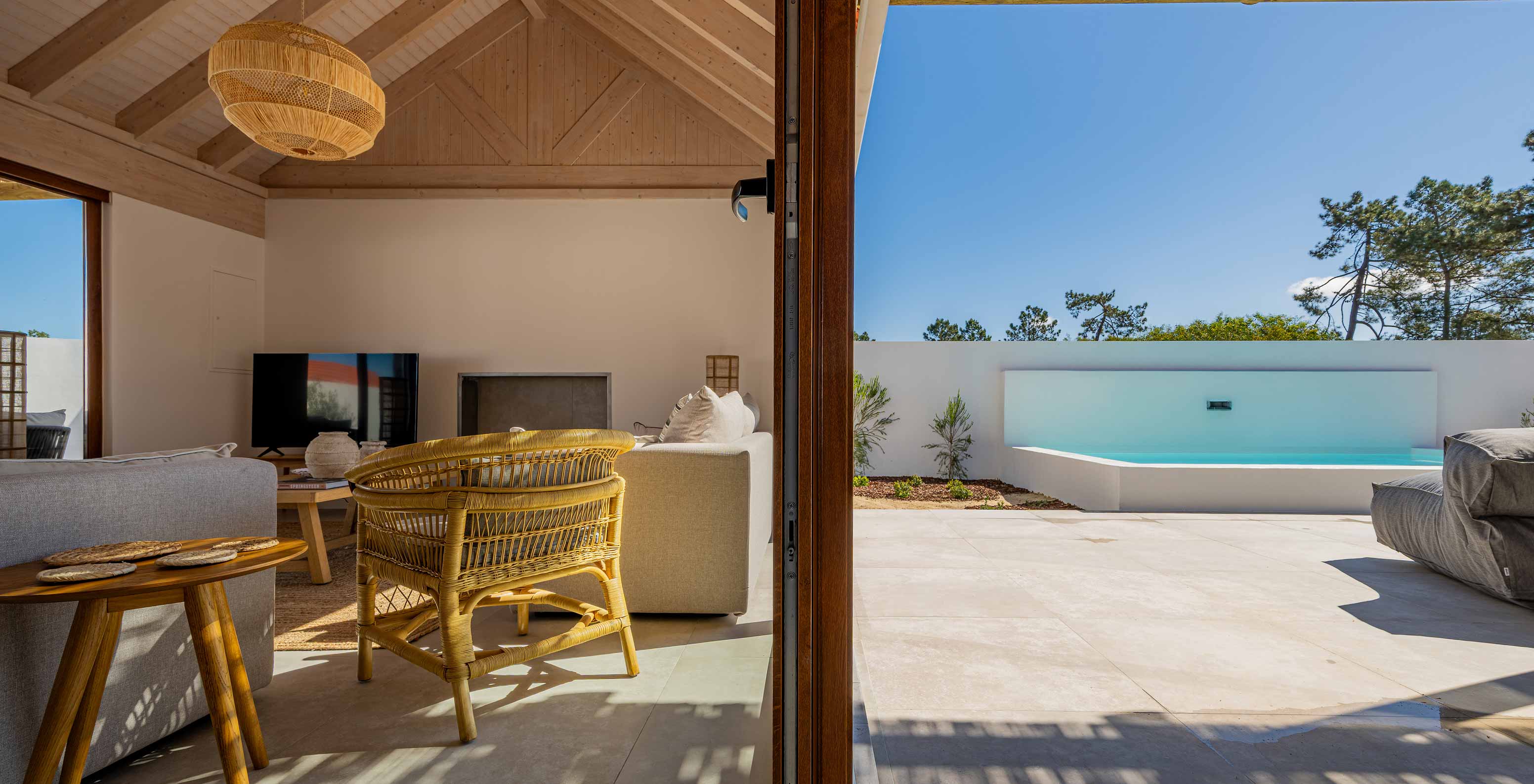 The Premium Villa at Pestana Comporta Village Residences has a living room with a view of the outdoor pool