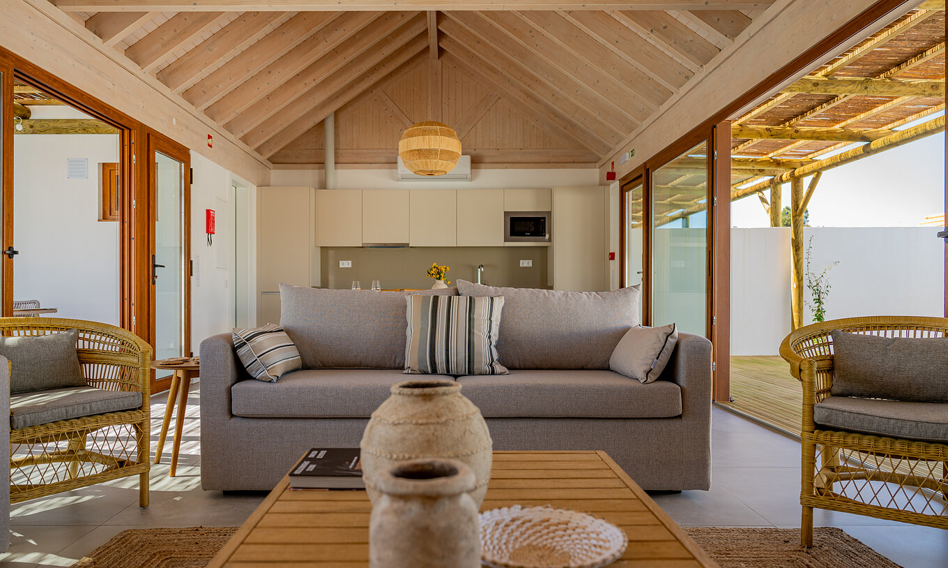 The Premium Villa at Pestana Comporta Village Residences has a bright living room with a sofa and decor