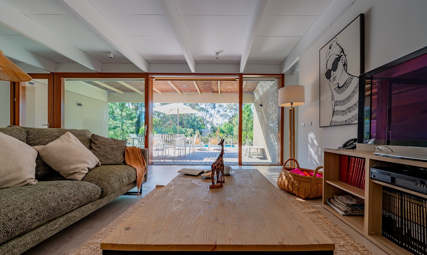 The 4-Bedroom Villas of Pestana Tróia Eco Resort have a room with sofa, access to the terrace, and television