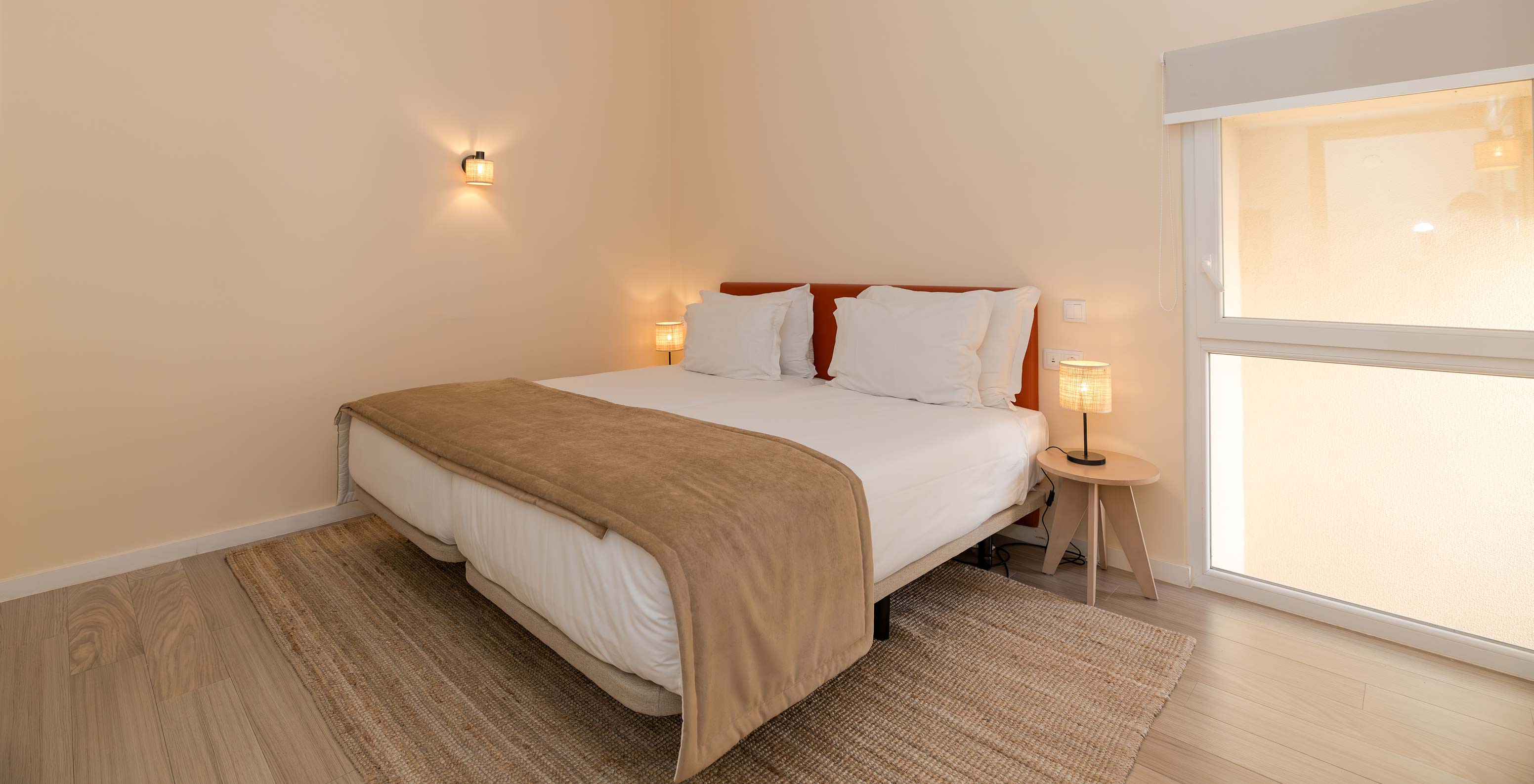 Villa 2 Bedrooms Superior Garden View at Pestana Alvor Beach Villas has a bedroom with double bed and bedside tables
