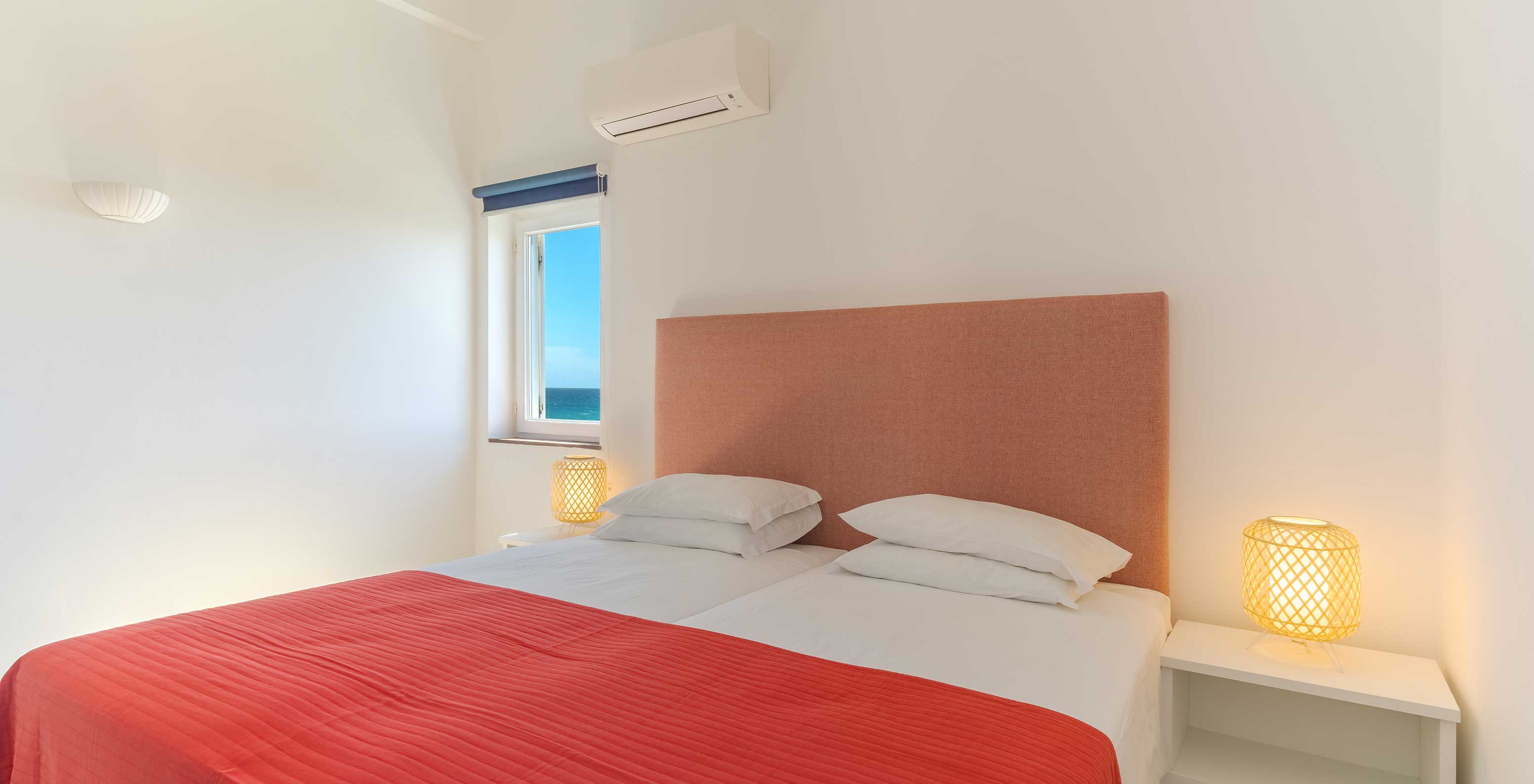The 3 Bedroom Premium Sea View Villa at Pestana Alvor Beach Villas has a bedroom with two beds