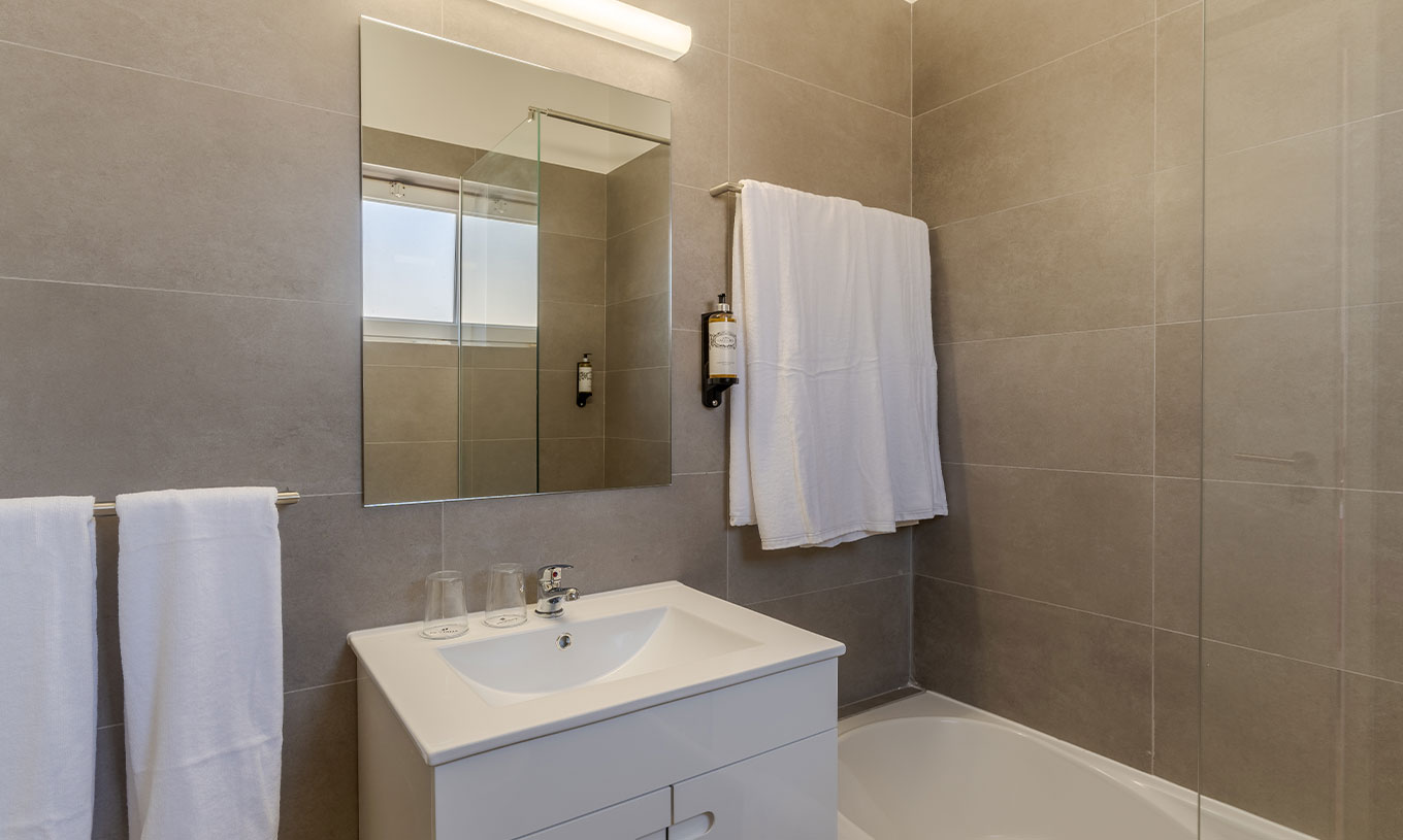 The 3 Bedroom Premium Sea View Villa at Pestana Alvor Beach Villas has a bathroom with a sink and towel