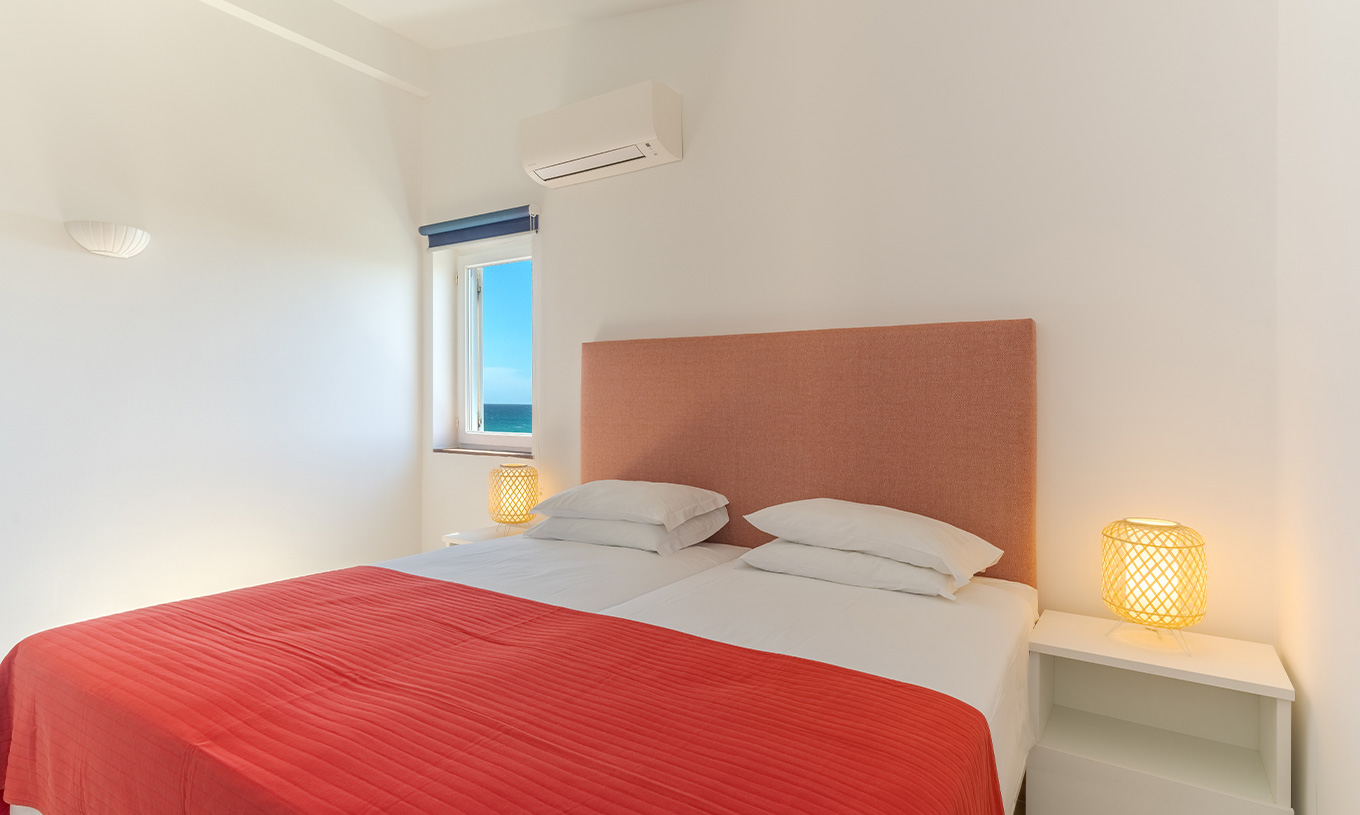 The 3 Bedroom Premium Sea View Villa at Pestana Alvor Beach Villas has a bedroom with two beds