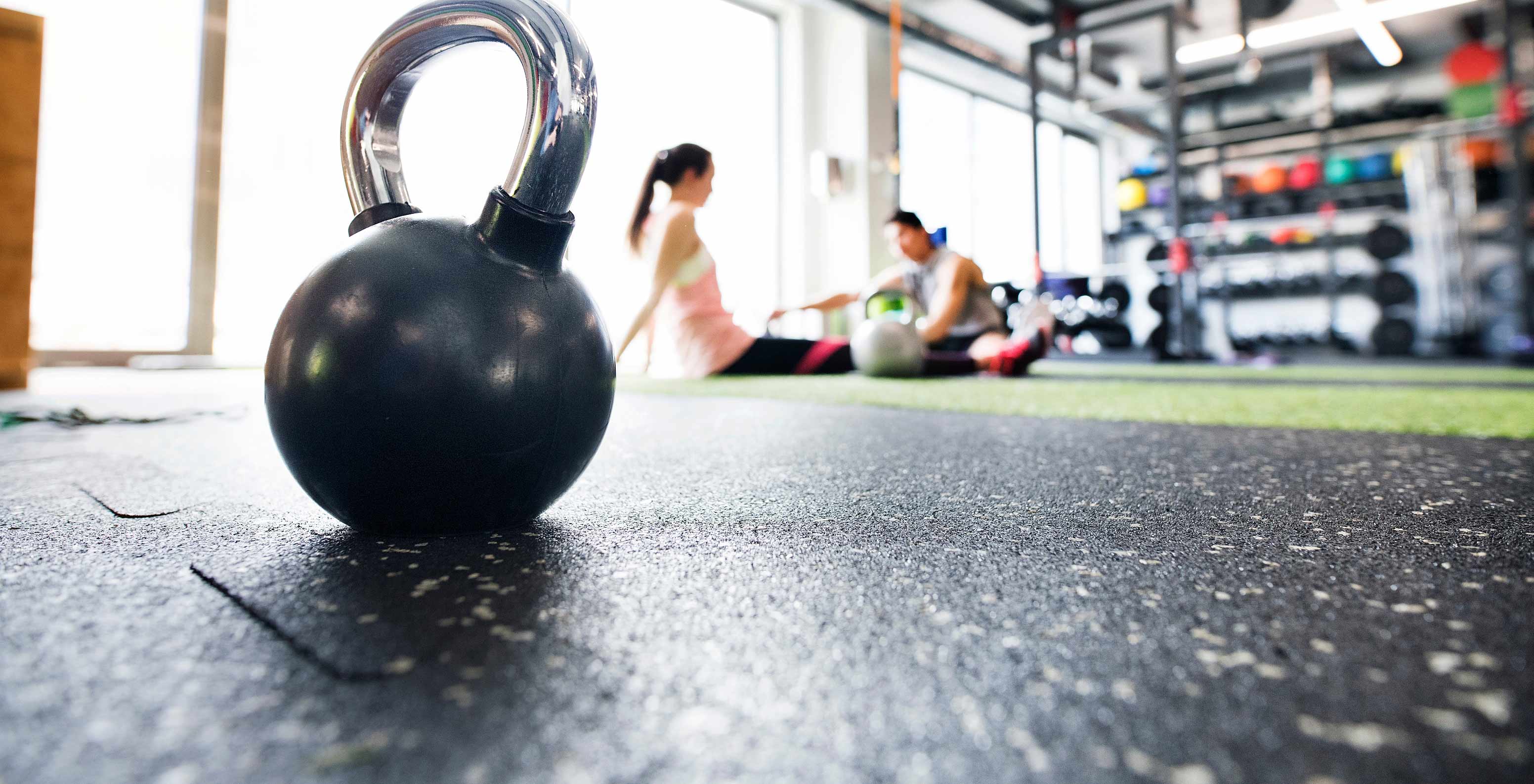 Focus on kettlebell, guests training in gym at Pestana Alvor Park, 4-star Aparthotel in Alvor with swimming pool