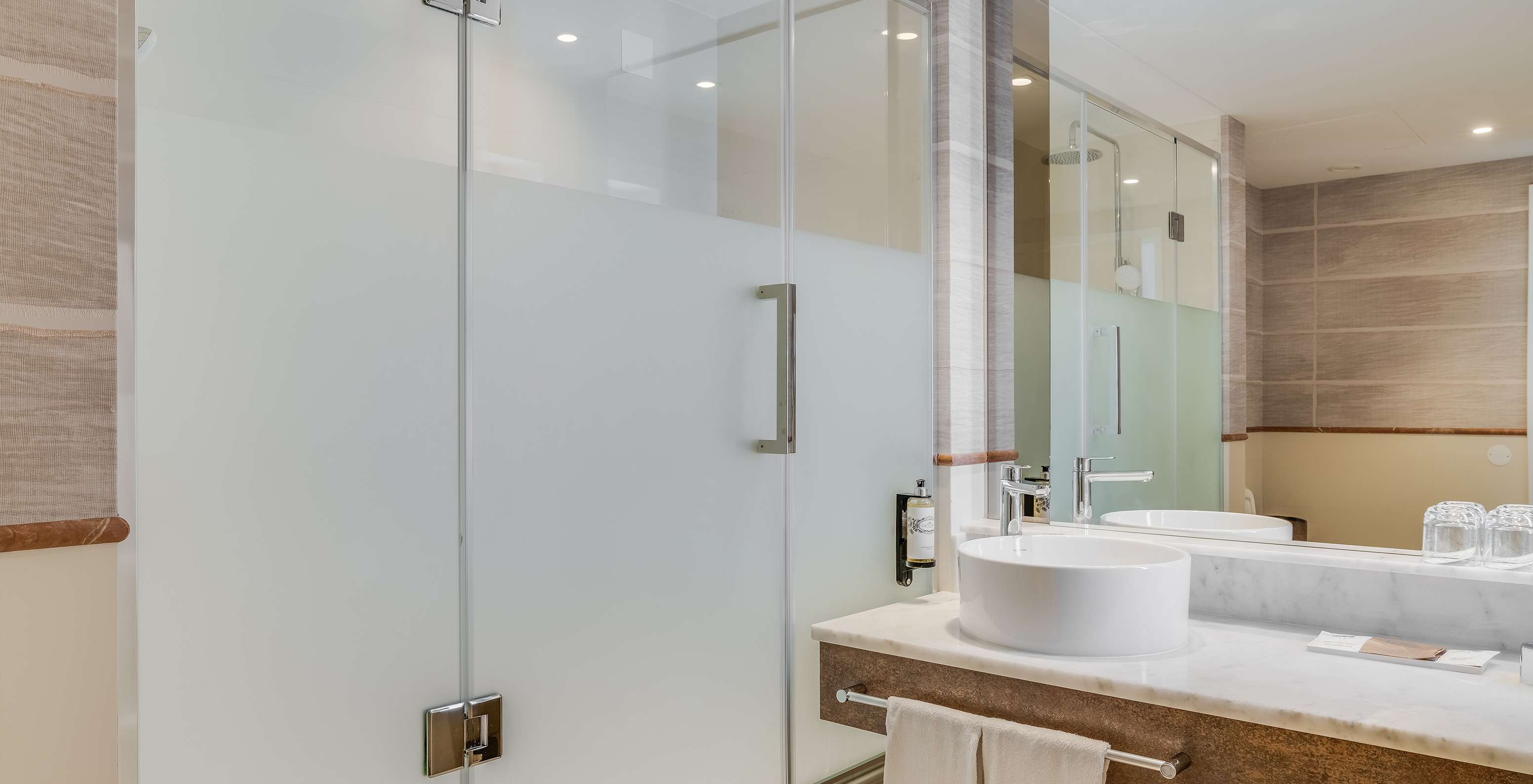 The Superior Family Sea View Room at Pestana Blue Alvor Beach has a bathroom with a sink, mirror, and a shower