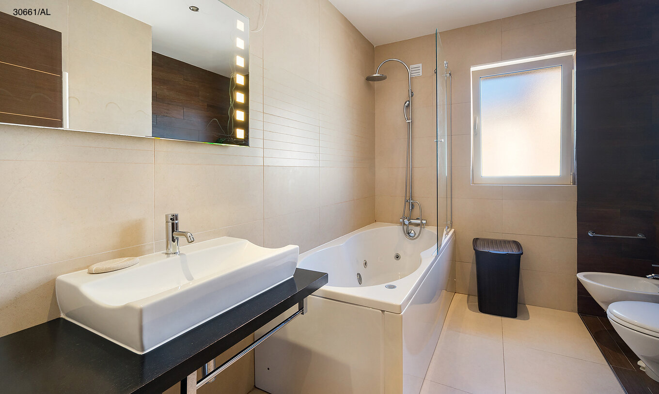 The Pestana Carvoeiro Golf T1 Superior Apartment has a bathroom with a bathtub and a sink with a mirror
