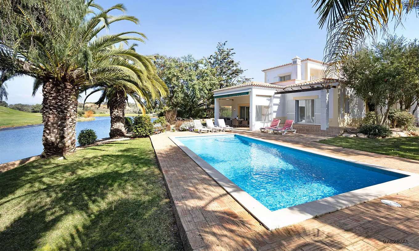 The Pestana Carvoeiro Golf V3 Standard Villa has an exterior patio with grass and a rectangular pool