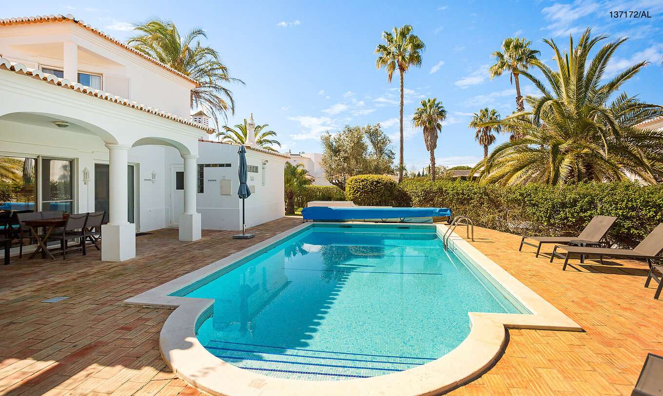 The Pestana Carvoeiro Golf V3 Standard Villa has an exterior patio with a pool and loungers