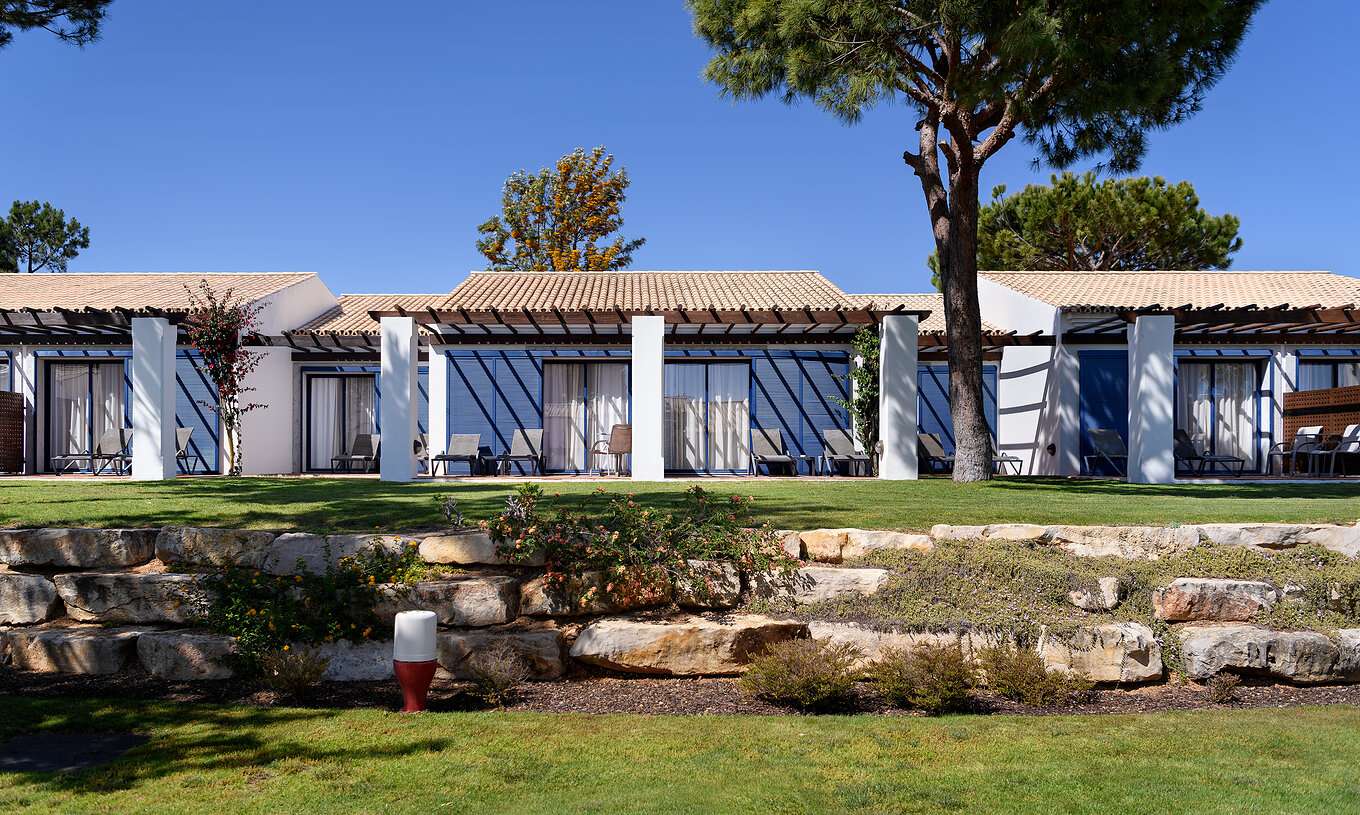 The Suite Garden View at Pestana Vila Sol - Vilamoura has a balcony with sun loungers and direct access to the garden