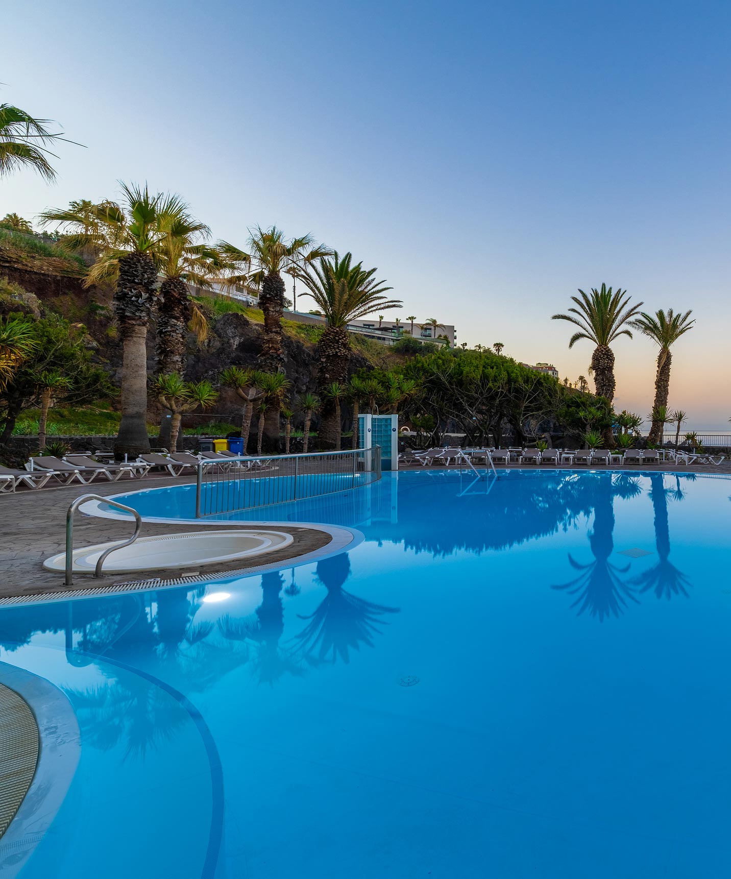 Pestana Ocean Bay All Inclusive, an Oceanfront All-Inclusive Hotel, with a pool and several palm trees