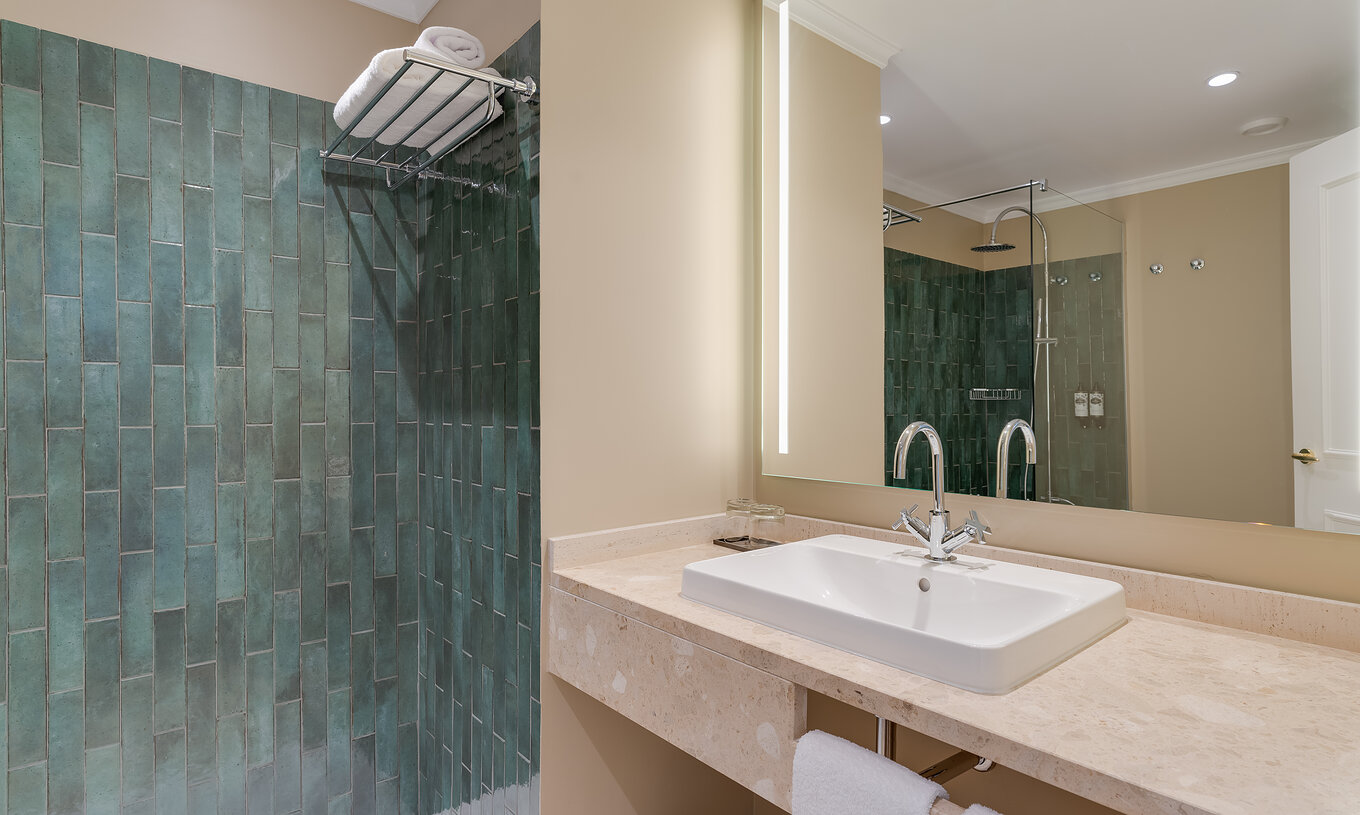 Classic Interior View room at Pestana Quinta Perestrello has a bathroom with sink, mirror, and shower