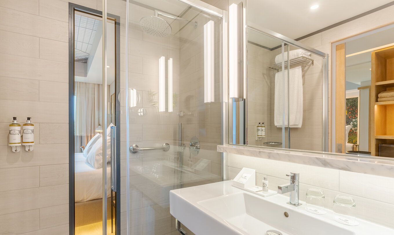 The Superior room at Pestana Douro Riverside features a bathroom with a sink, mirror, and shower
