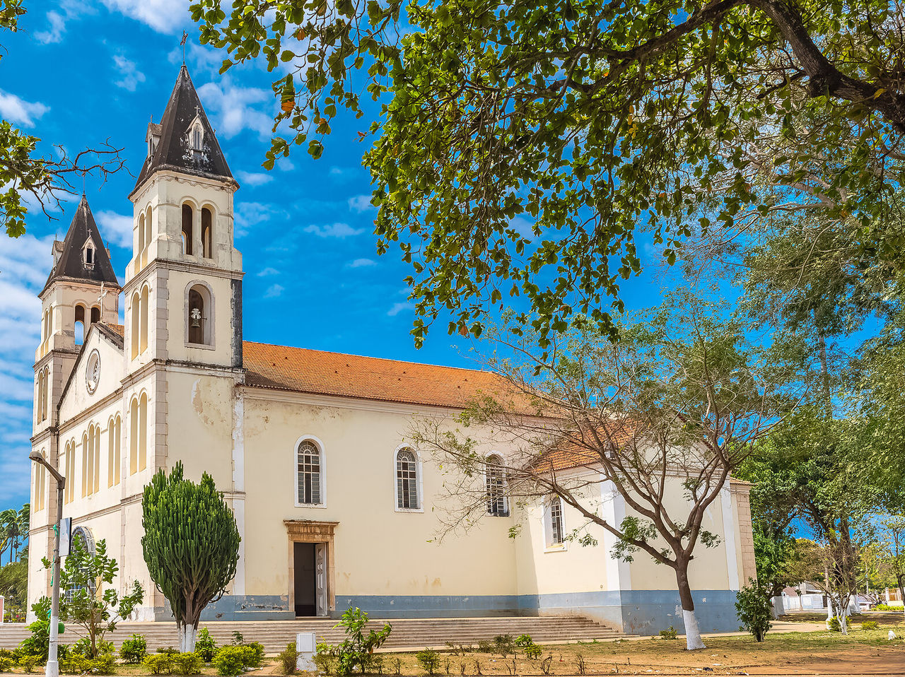 Cathedral of Our Lady of Grace in the center of São Tomé, with steps leading to it and trees around