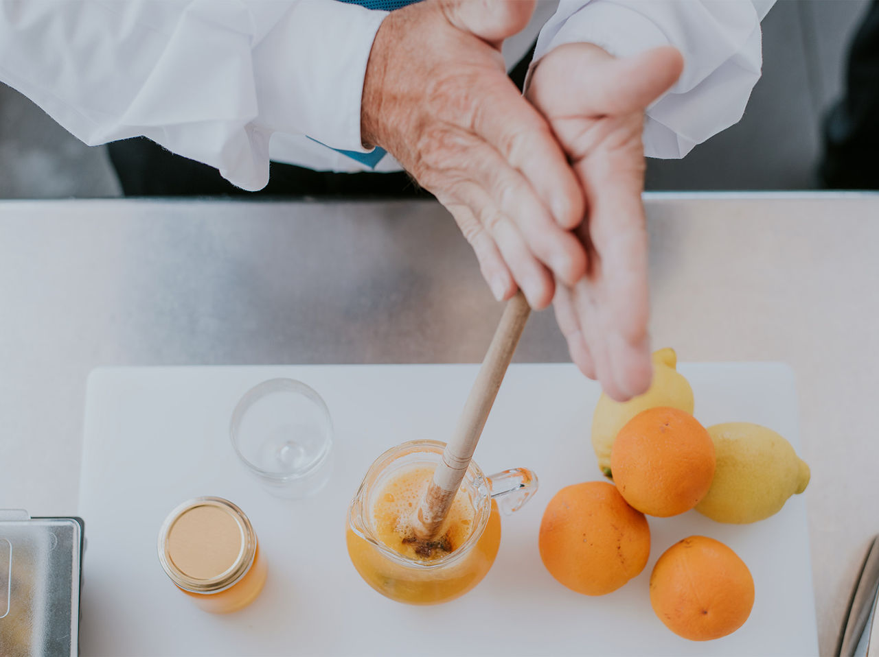 Atlântico Bar in Madeira has a staff member preparing the local poncha with lemons and oranges
