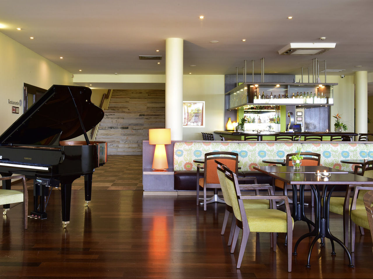 The Tapas Bar, at the 4-Star Hotel in Porches, has tables, chairs, a piano, and a bar for drinks