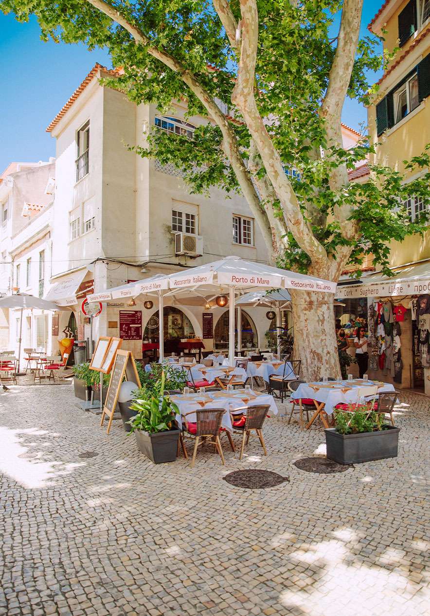 Outdoor terrace in Largo de Camões in Cascais with umbrellas and tables