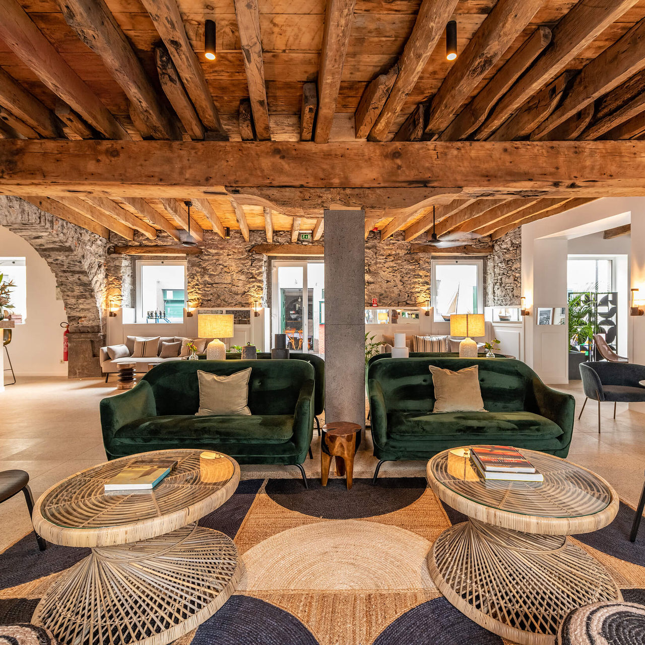 Living room with sofas, tables, and wooden ceiling, at the Boutique hotel in Câmara de Lobos