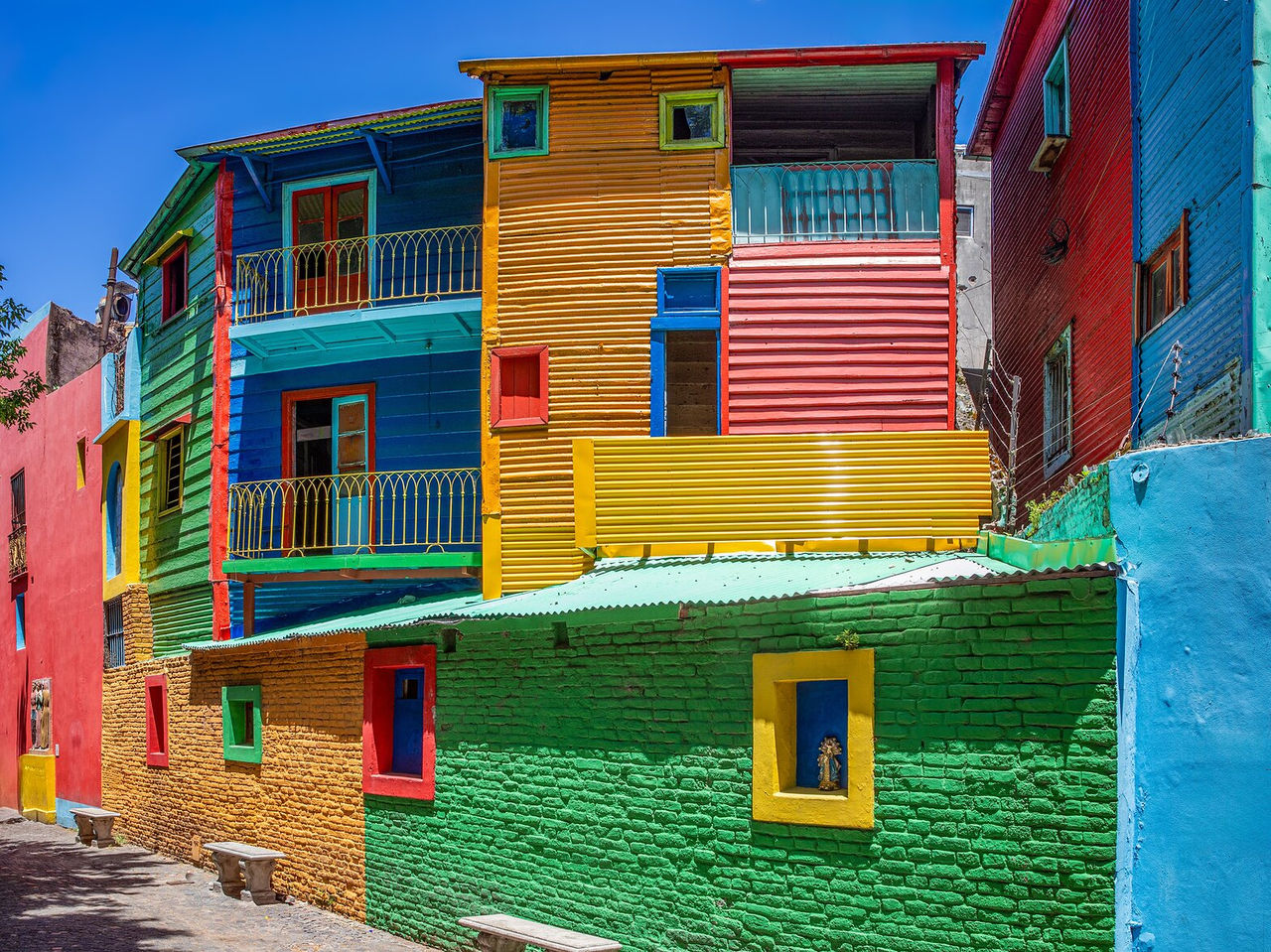 Colorful house facades, typical of Caminito, a neighborhood in Buenos Aires known for its artistic atmosphere
